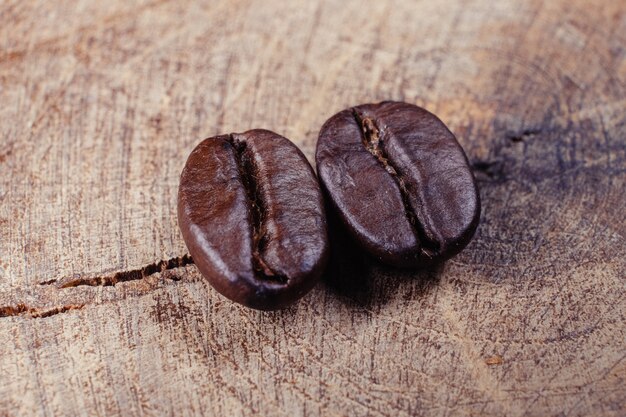 Coffee Bean on wood background with filter effect retro vintage style