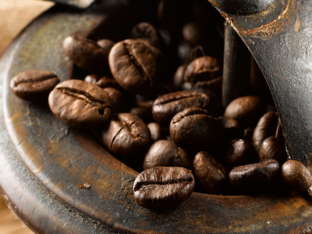 coffee beans in antique coffee grinder