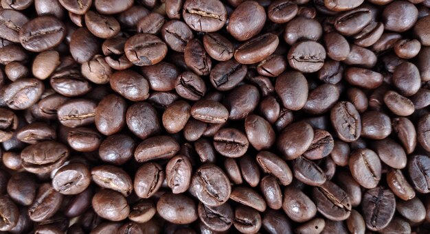 Photo coffee beans background close up of roasted coffee beans