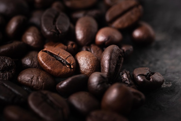 Coffee beans background,Coffee beans close up,Closeup of coffee beans at roasted coffee heap.