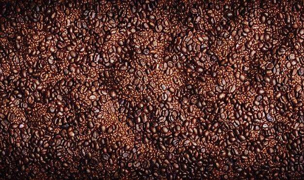 Photo coffee beans background freshly roasted coffee beans can be used as background coffee composition