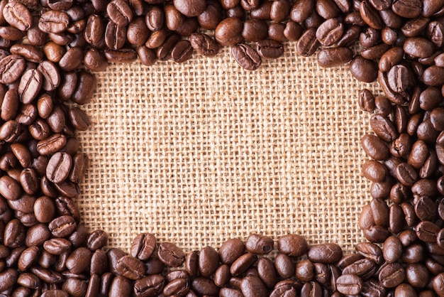 Coffee beans on bag background with copy space