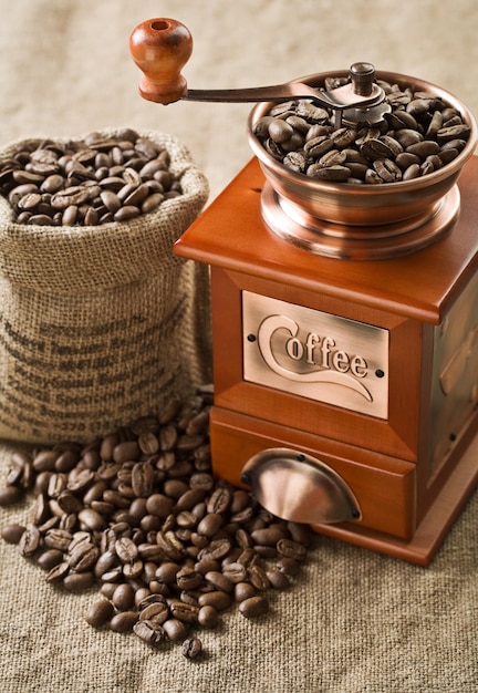 Coffee beans in bag and coffee mill