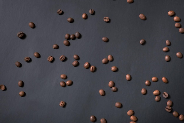 Coffee beans on black background top view