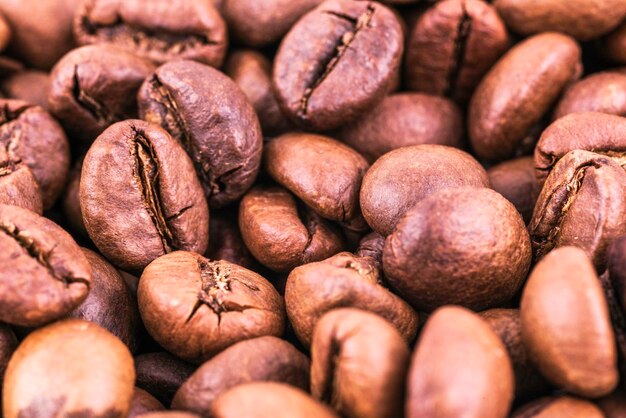 Coffee beans closeup background with artificial light