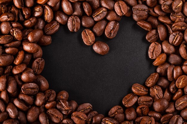 Coffee beans closeup on black background