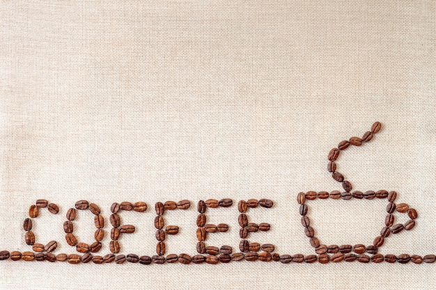 Coffee beans on cloth background.