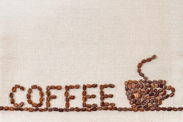 Coffee beans on cloth background.