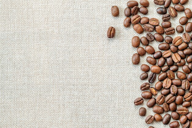 Coffee beans on cloth background.