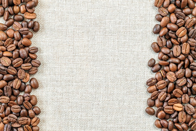 Coffee beans on cloth background.