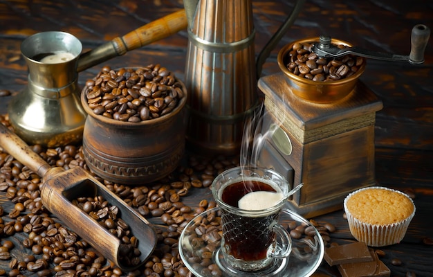 Coffee beans and a cup of coffee on a table