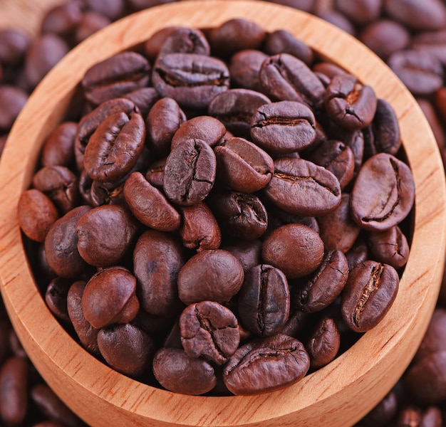 Coffee beans in a cup Wood