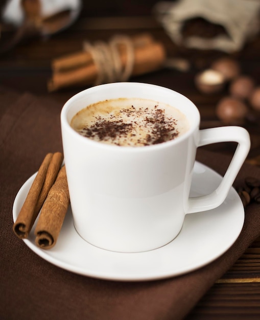 coffee beans in a cup on wooden table