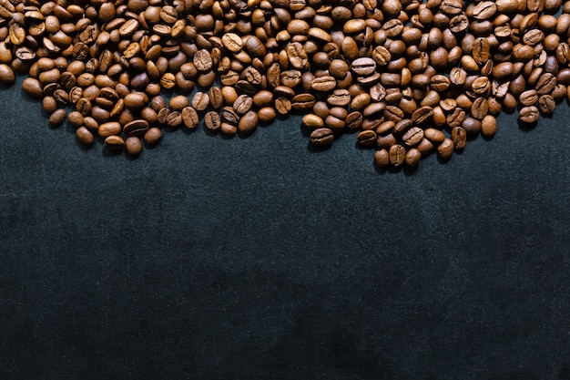 Coffee beans on dark background. Top View. Coffee concept.