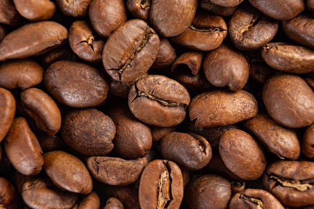 Coffee beans detailed on the background aromatic coffee beans place for inscription