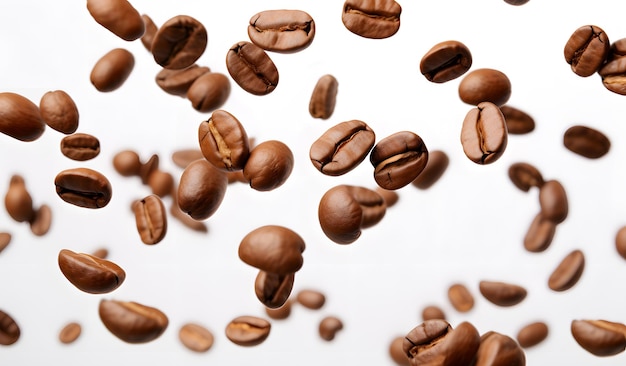 Coffee beans falling on white background closeup shot