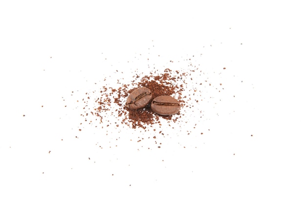 Coffee beans and freshly ground coffee isolated on white