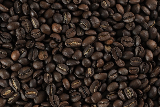 Coffee beans - freshly roasted beans  close-up photo - coffee background