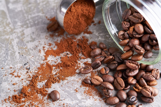 Coffee beans in a glass jar on a gray table