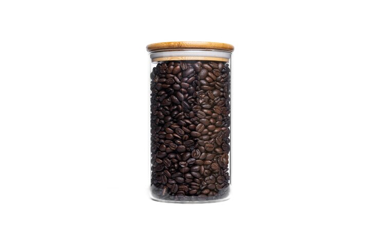Coffee beans in glass jar isolated