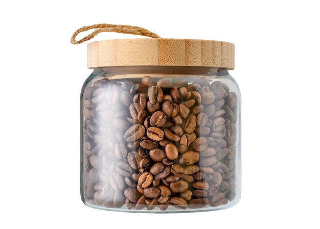 Photo coffee beans in glass jar with wooden lid isolated on white background