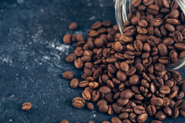 Coffee beans in glass jar.  .