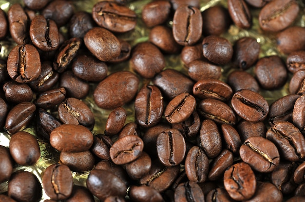 Coffee beans on gold background