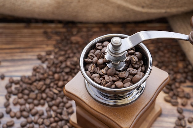 Photo coffee beans in grinder vintage style