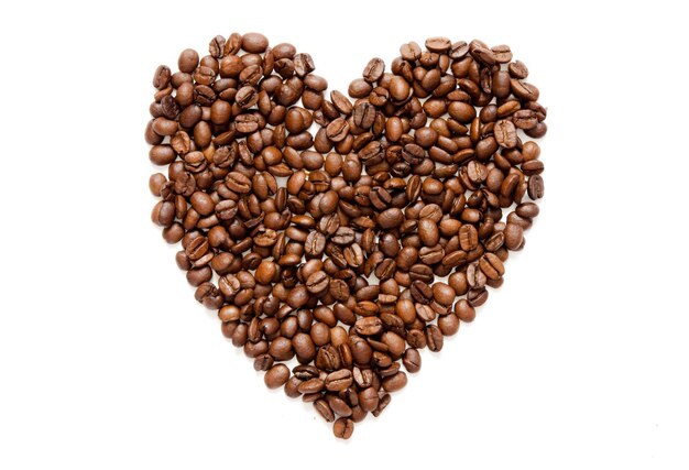 Coffee beans in heart shape white background isolated Image