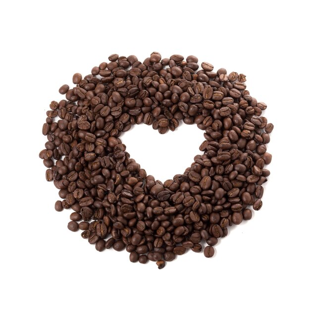 Coffee beans and heart-shaped spaces isolated on a white background