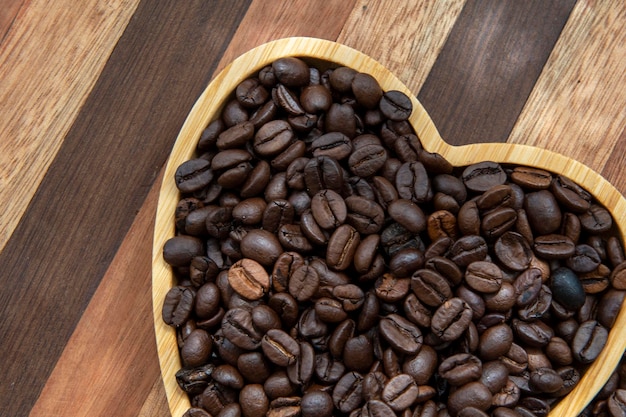 Coffee beans in heartshaped tray representing love of coffee