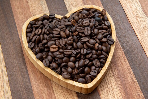 Coffee beans in heartshaped tray representing love of coffee