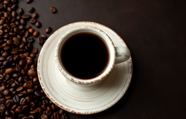 Coffee and beans on the old kitchen table. Top view with copyspace for your text.