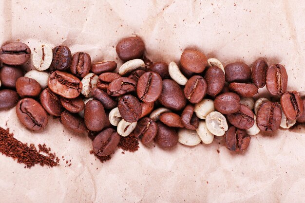 Coffee beans on piece of paper closeup