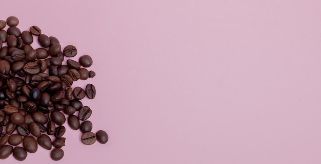 Coffee beans on a pink