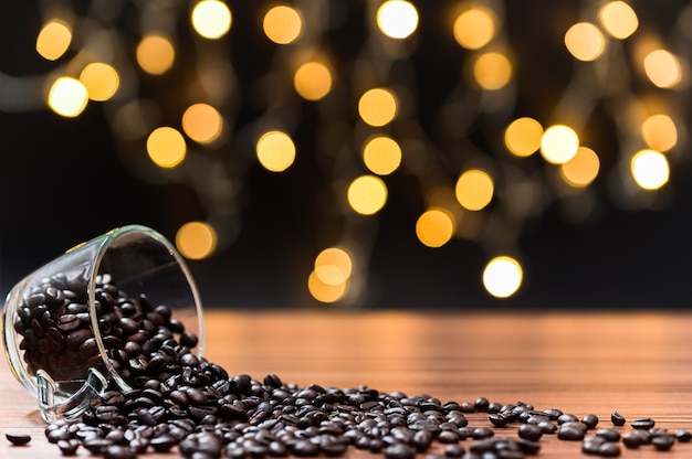 Coffee beans Placed on the desk Orange bokeh floor scene