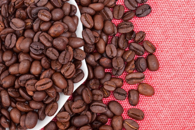 coffee beans on red cloth background