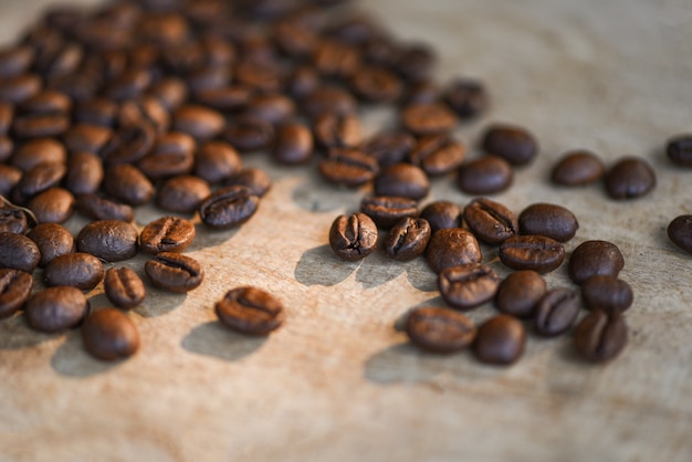 Coffee beans roasted on rustic wood 