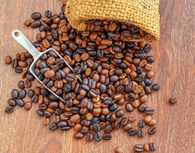 Coffee beans in sacks On a brown background