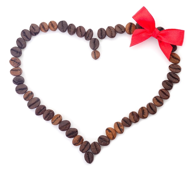 Coffee beans in the shape of a heart with a bow