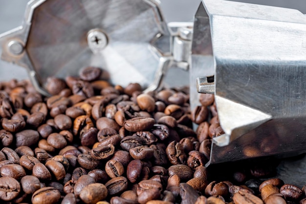 Coffee beans spill from the coffee maker