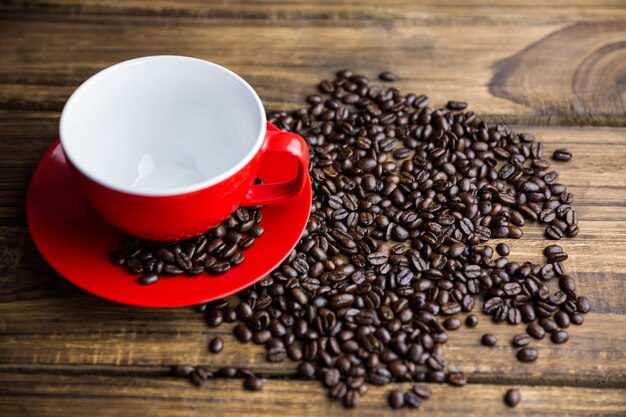 Coffee beans on a table with cup