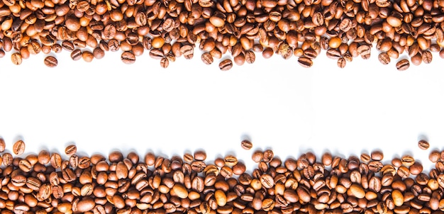 Coffee beans top view on a white background space for text