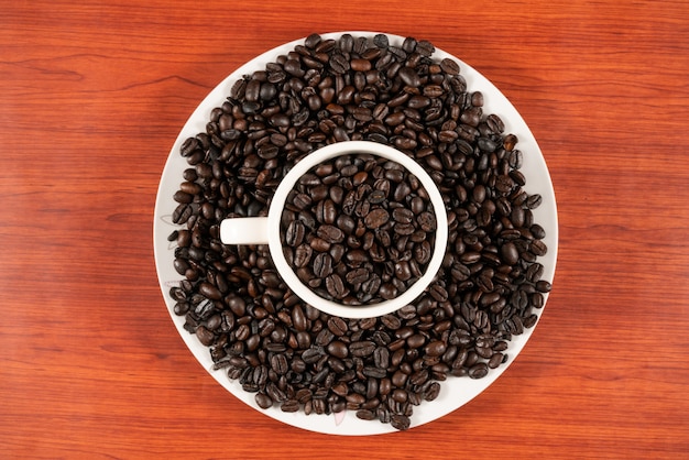 Coffee beans in white cup 