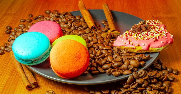 Coffee beans with cookies on a plate.