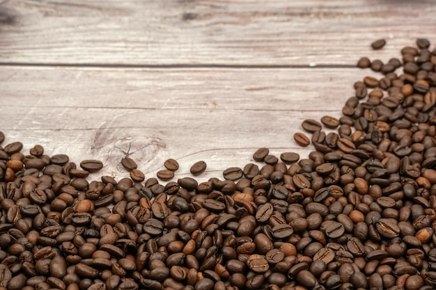 Coffee beans on wood background