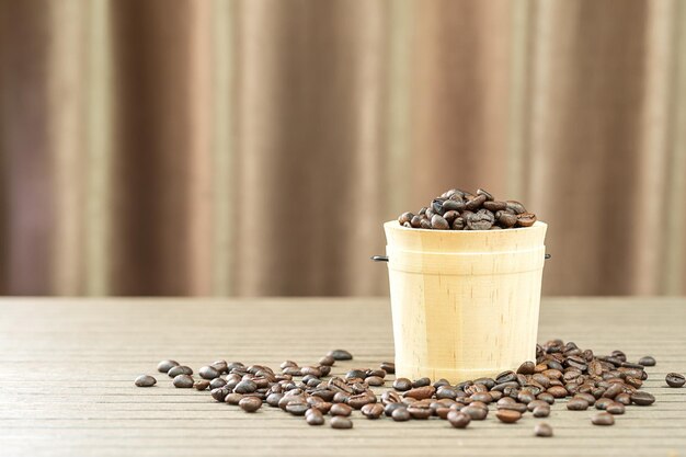 Coffee beans in wood bucket