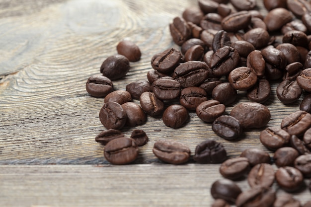 Coffee beans on wood surface