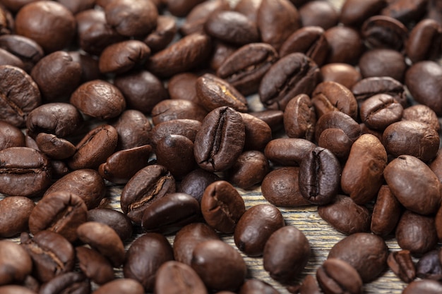 Coffee beans on wood surface