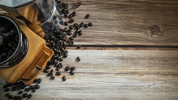 the coffee beans on wood table for hot drink or coffee concept.